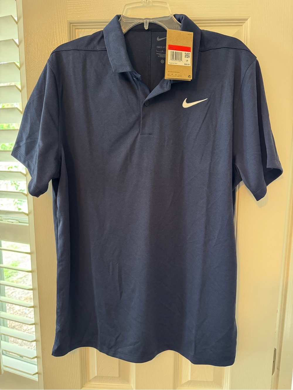 Nike Men's Navy Polo with White Swoosh